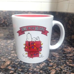 Peanuts home for the holidays mug featuring snoopy